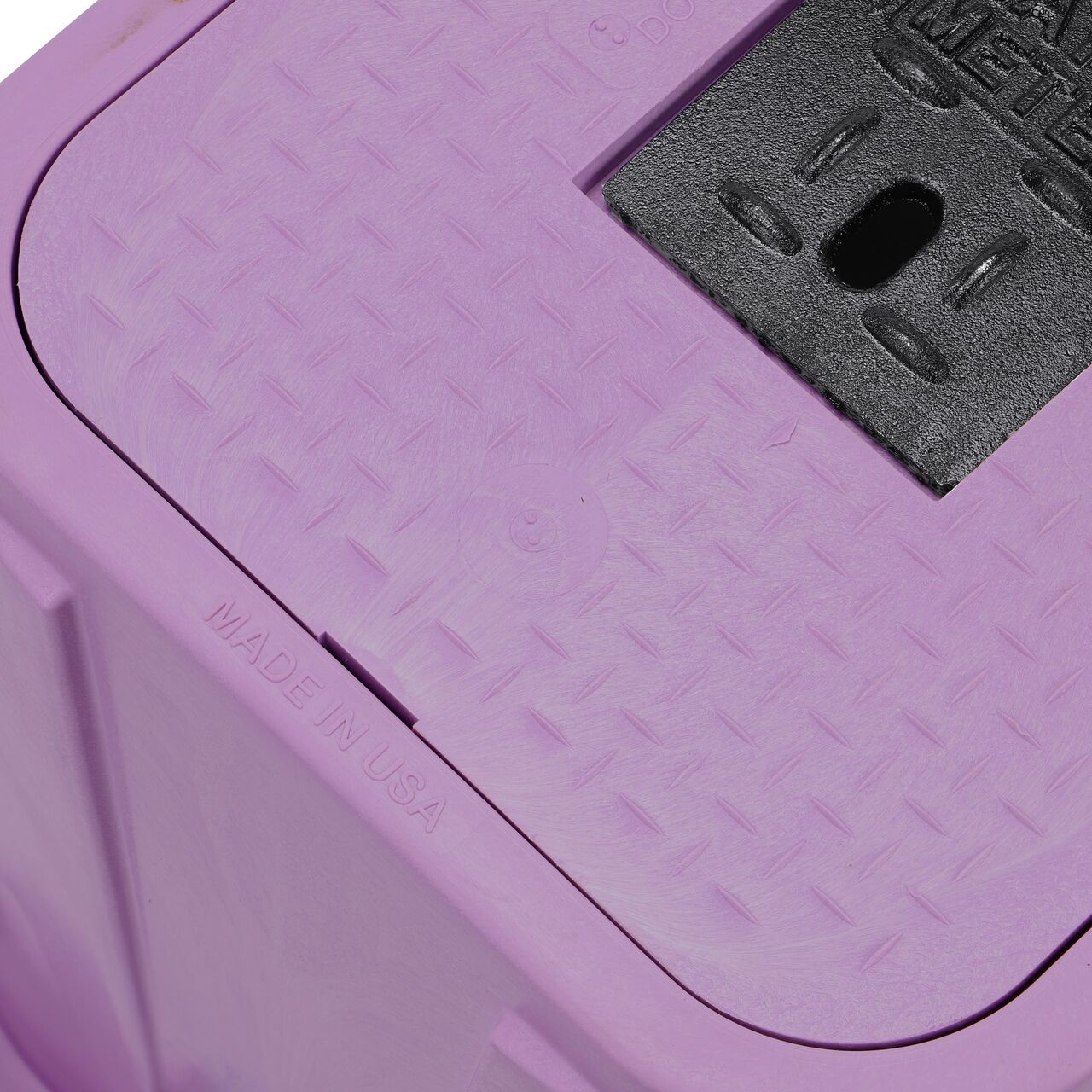 Closeup view of the pipe hole on the purple NDS 14 in. X 19 in. Rectangular Standard Series Meter Box (NDS D1200P-DICIRP) for water and irrigation pipe connections