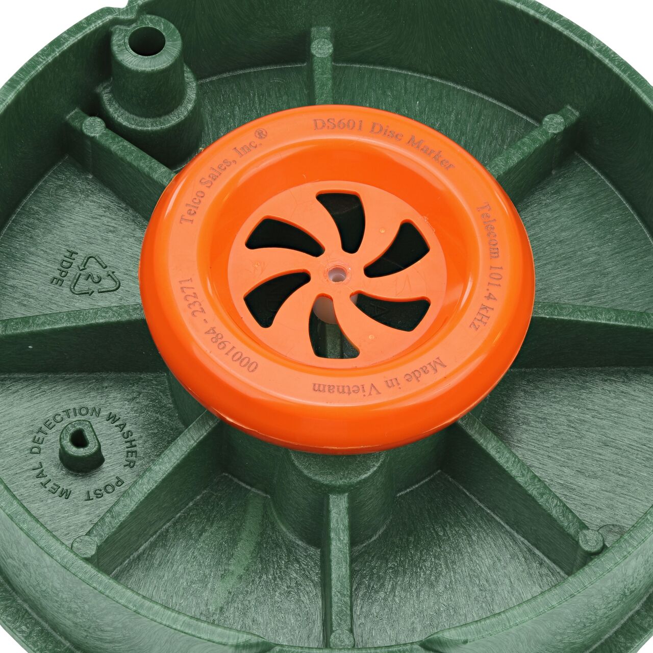 The first step in removing the electronic marker disc is to remove the center screw on the underside of the telecom cover for the NDS 10 in. Round Pro-Spec® Series Telecom Box (NDS 311BCBT-M)