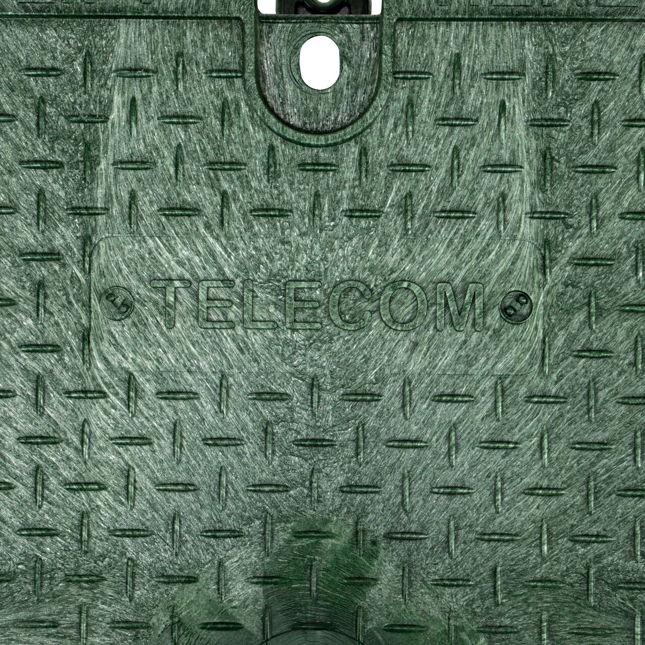 Closeup view of the Telecom markings on the green telecom cover for the NDS 14 in. X 19 in. Rectangular Pro-Spec Series Valve Box & Telecom Cover (NDS 313BCBT)