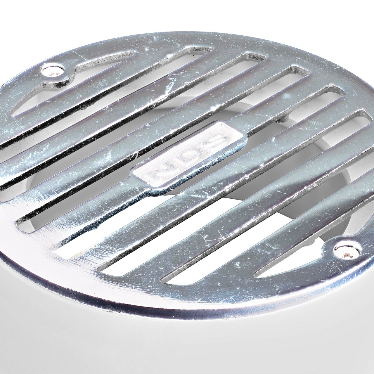 Closeup of the grate pattern on the NDS 4 in. Round Grate (NDS 908PC)