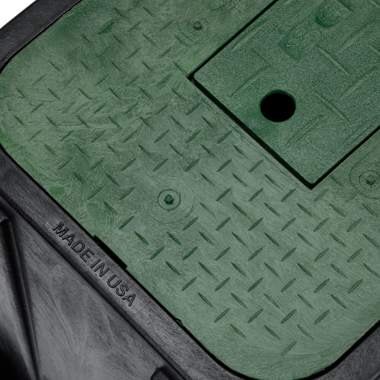 The drop-in meter box lid securely in place on the NDS 14 in. X 19 in. Rectangular Standard Series Black Meter Box and Green Water Meter Cover with Plastic reader door (NDS D1200-DIRG) keeping components protected against the elements, foot traffic, lawn care equipment, and potential vandalism while keeping them out of sight
