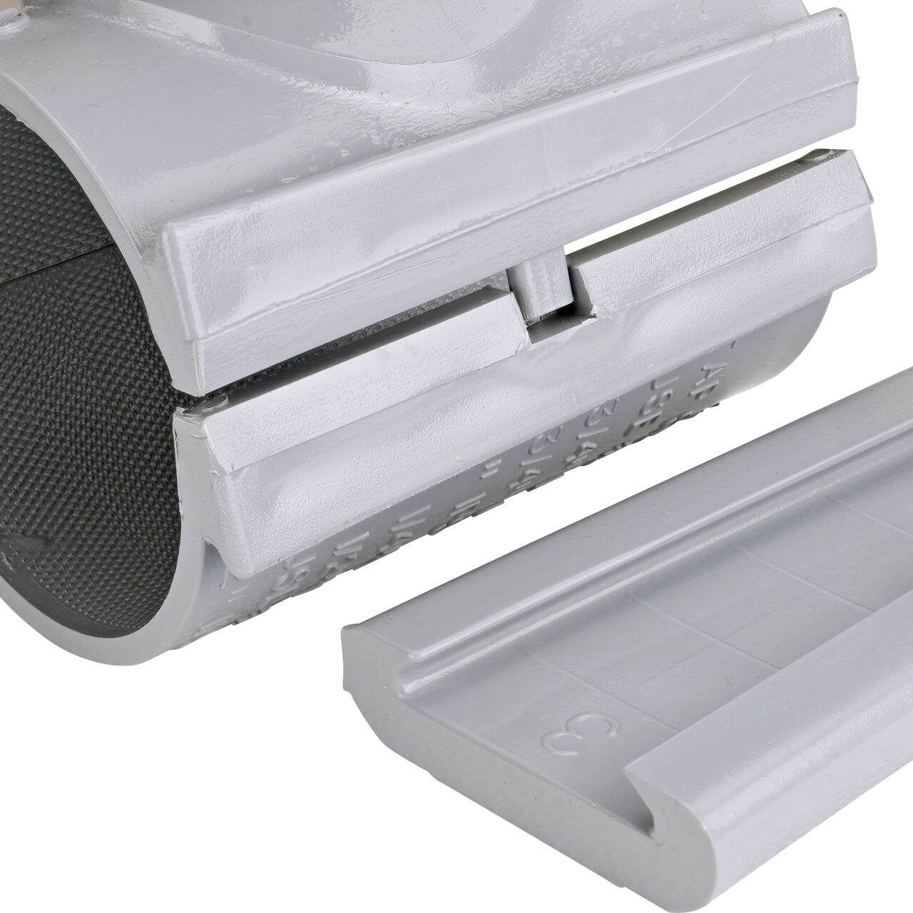 Closeup view of the patented wedge which unconnects on the 3 in. NDS Flo-Tap™ Rigid PVC saddle with 1-1/2 in. socket or 2 in. spigot for easy installation (NDS 3230)