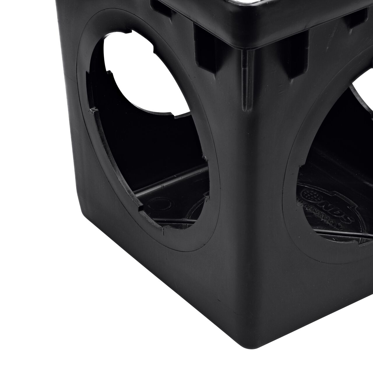 Closeup view of the outlet holes and inside of the NDS 12 in. 4-outlet Catch Basin Drain (NDS 1204)