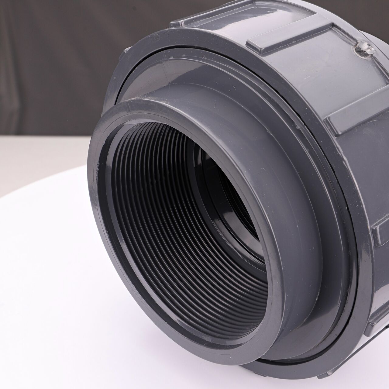 Closeup view of one threaded end on the NDS 4 in. PVC Union (NDS U-4000-T) which provides a corrosion-free connection between pipes and prevents costly property damage