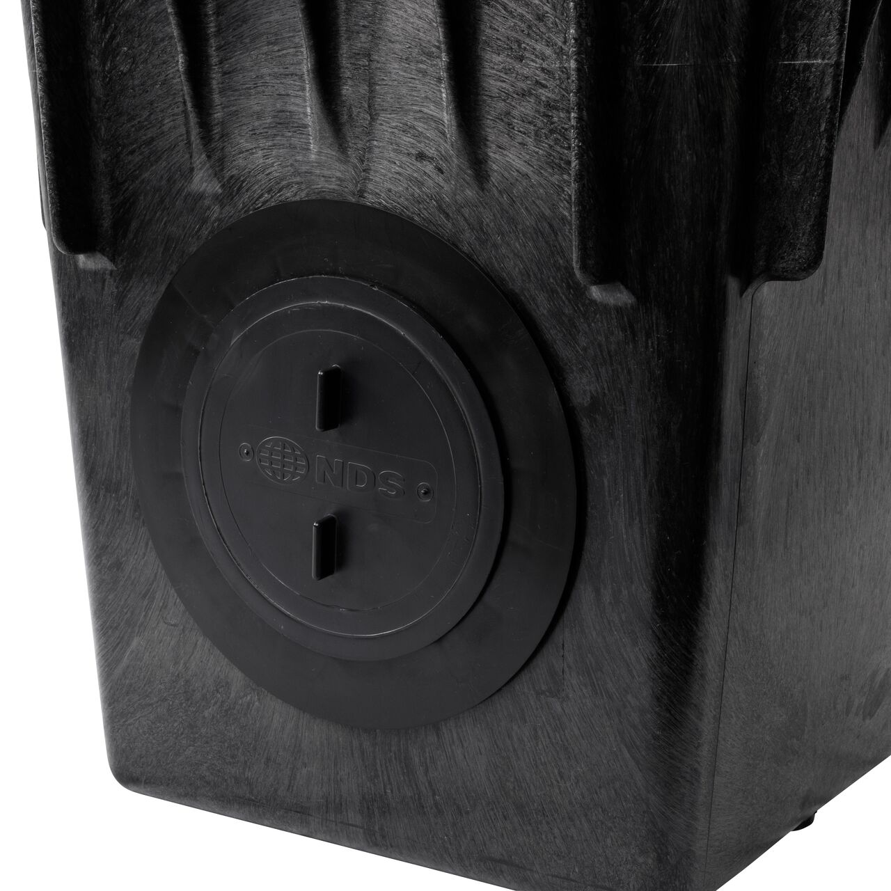 Closeup view of the outlet plug (NDS 1206) on the NDS 18 in. Catch Basin Drain with two-opening outlets (NDS 1882) with the NDS Reducer Ring attached (NDS 1890)