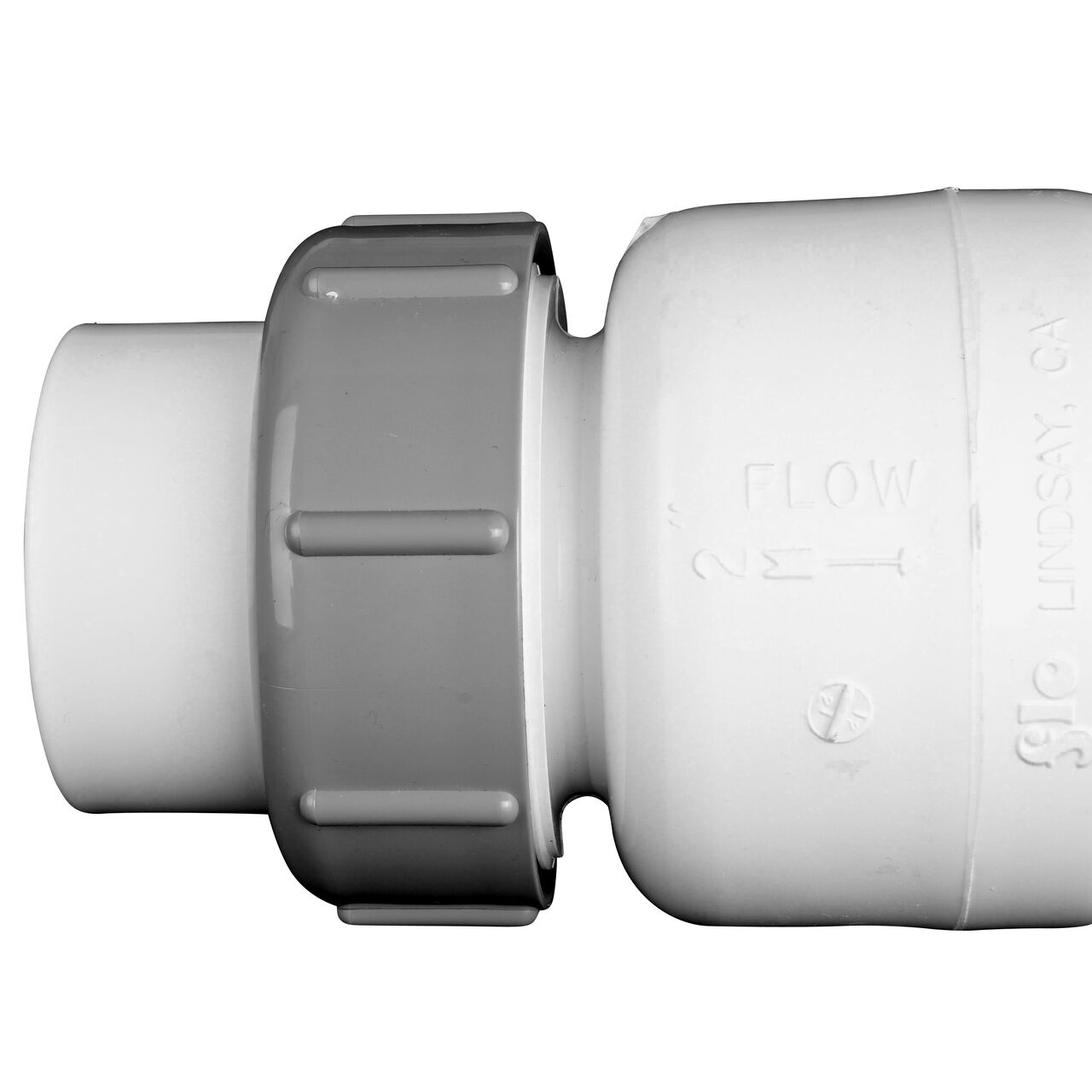 Closeup of the arrow showing water flow of the NDS White 2 in. slip end by slip end PVC True Union Spring Check Valve with 1/2 lb. Spring (NDS 1700-20)