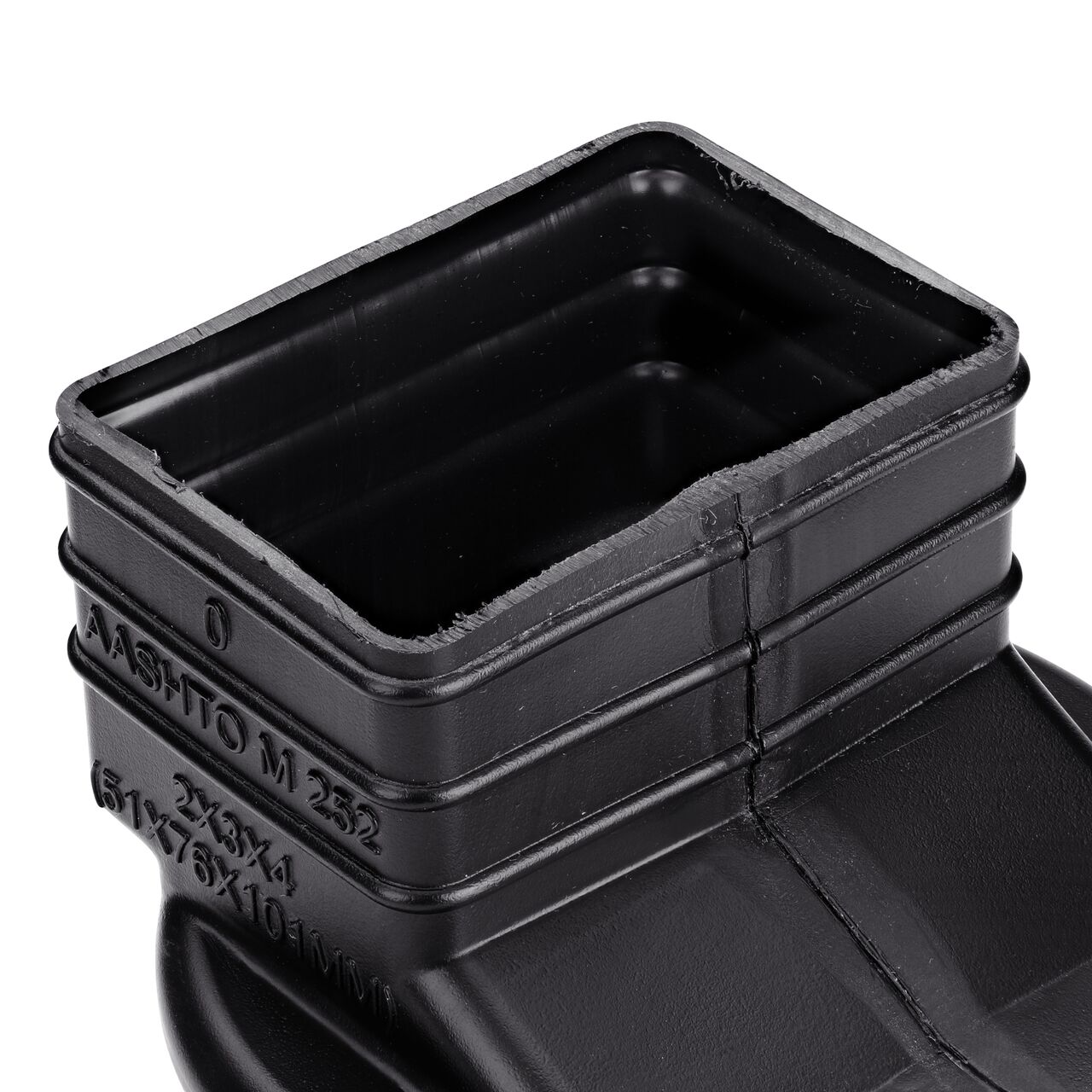 Closeup of the opening at the bottom of the HDPE Downspout Adapter which transitions 2X3 in. Downspout to 4 in. Hub (NDS 234CDS)