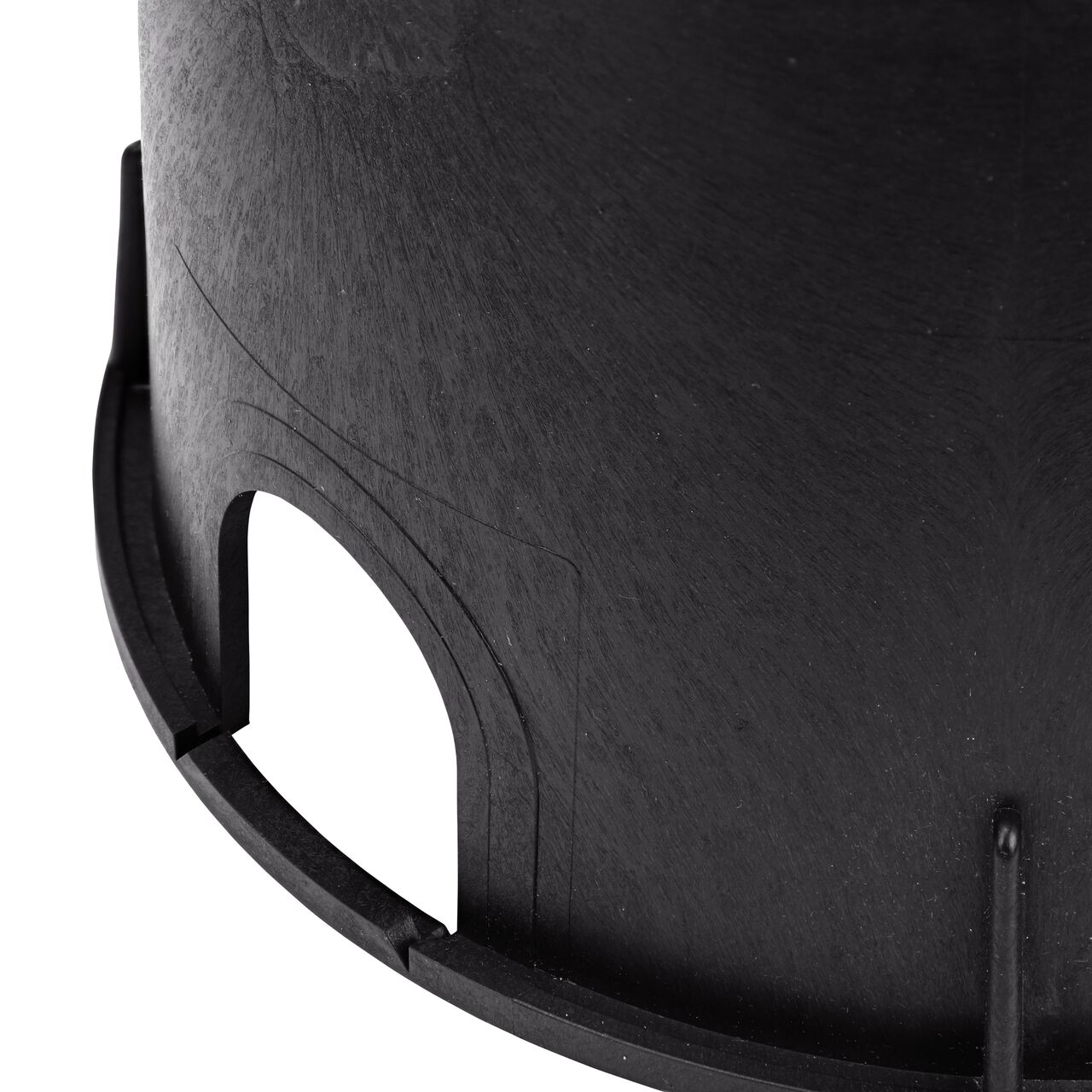 Closeup view of the pipe hole on the black NDS 10 in. Round Standard Series Valve Box (NDS 111BCS) for water and irrigation pipe connections