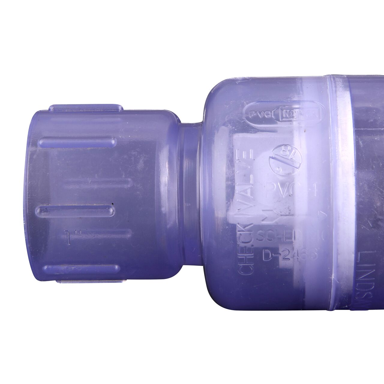 Closeup of the arrow showing water flow of the NDS Clear 1 in. slip end by slip end PVC Spring Check Valve (NDS 1011C10)