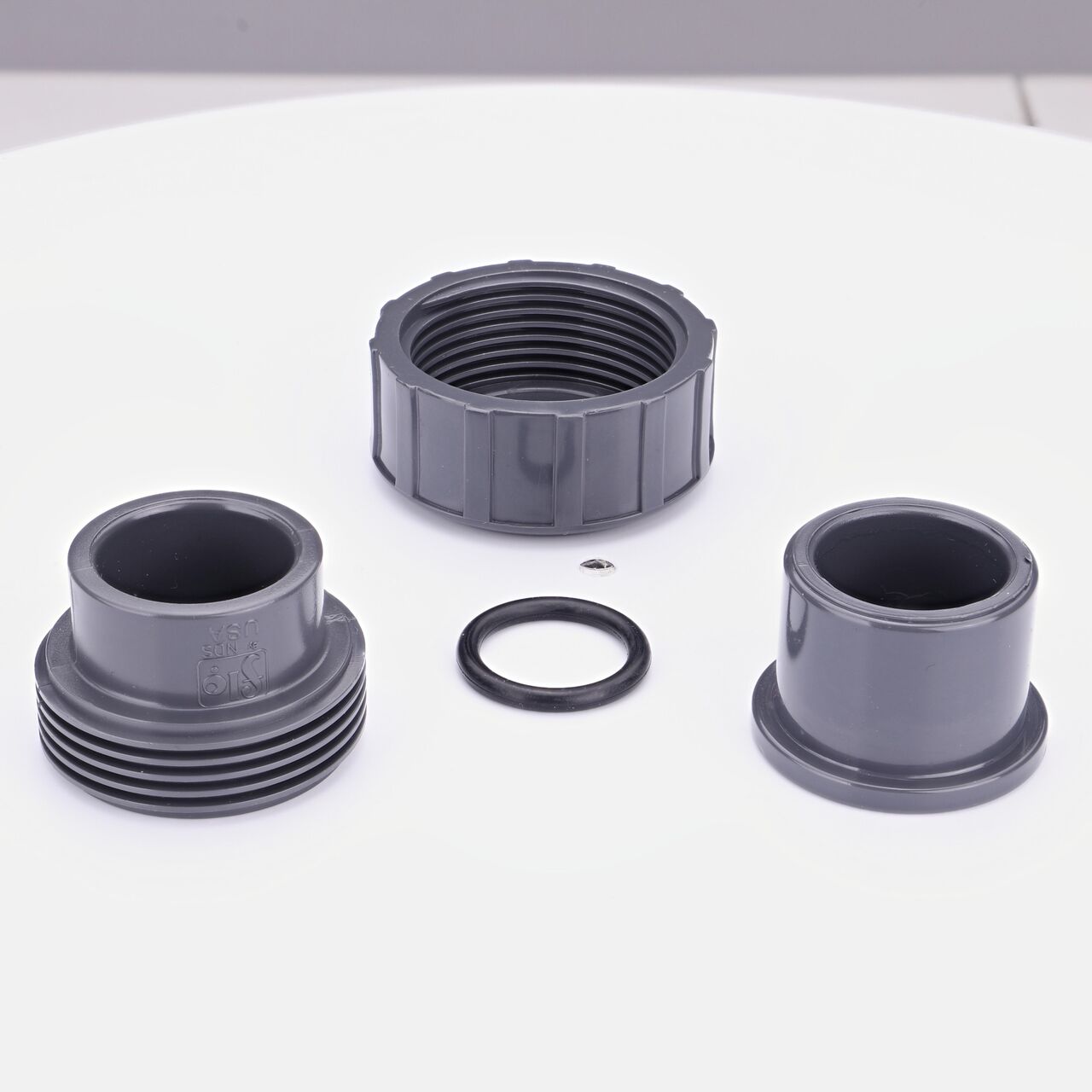 The NDS 3/4 in. PVC Union shown here unassembled, includes the EPDM O-ring that is placed in the center of the union to create a leak-resistant seal (NDS U-0750-S)