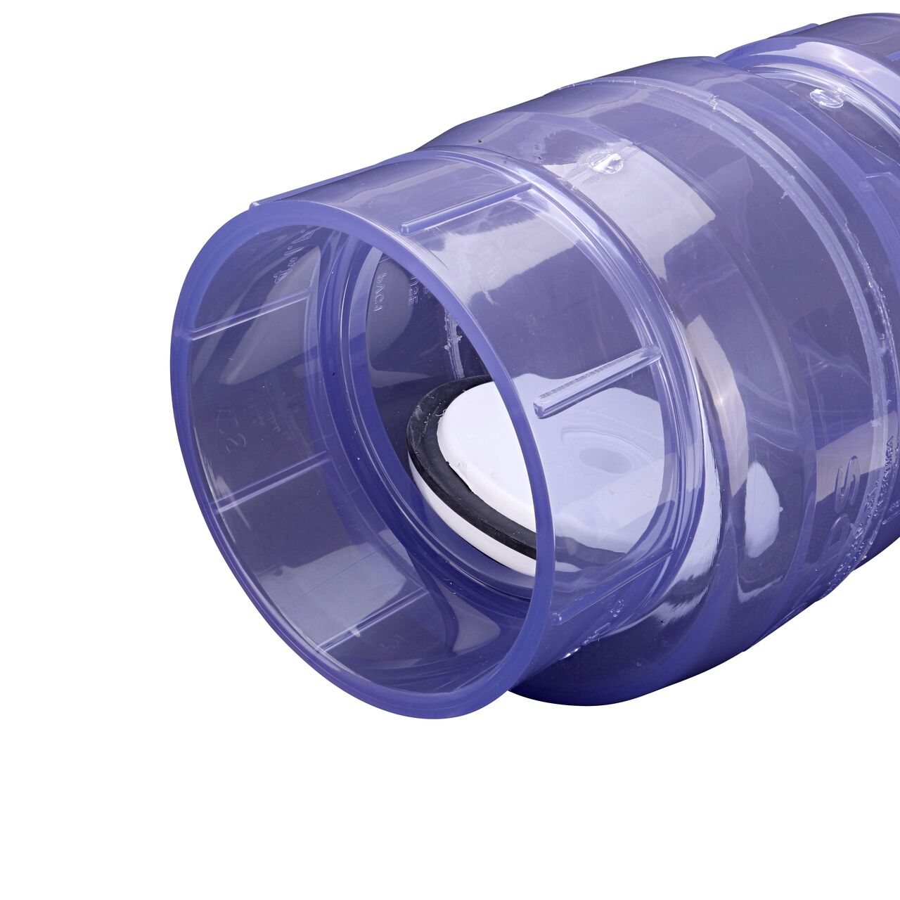 Closeup of the inlet end of the NDS Clear 4 in. slip end by slip end PVC Swing Check Valve (NDS 1520C40) which prevents backflow in pipelines