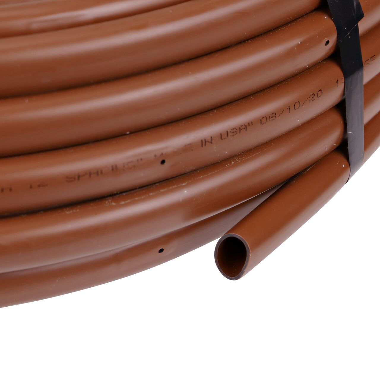 Closeup of the end of the NDS Black Tubing with 1.0 GPH Pressure Compensating Emitters with 12 in. Spacing to show how to pull out the dripline (NDS SFCV-BR-7212-01, NDS SFCV-BR-7412-01, NDS SFPC-BR-7212-01)