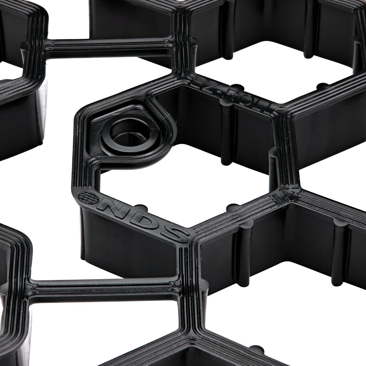 Bottom side closeup view of the support provided by the NDS EZ Roll® Grass Pavers as well as the stake hole