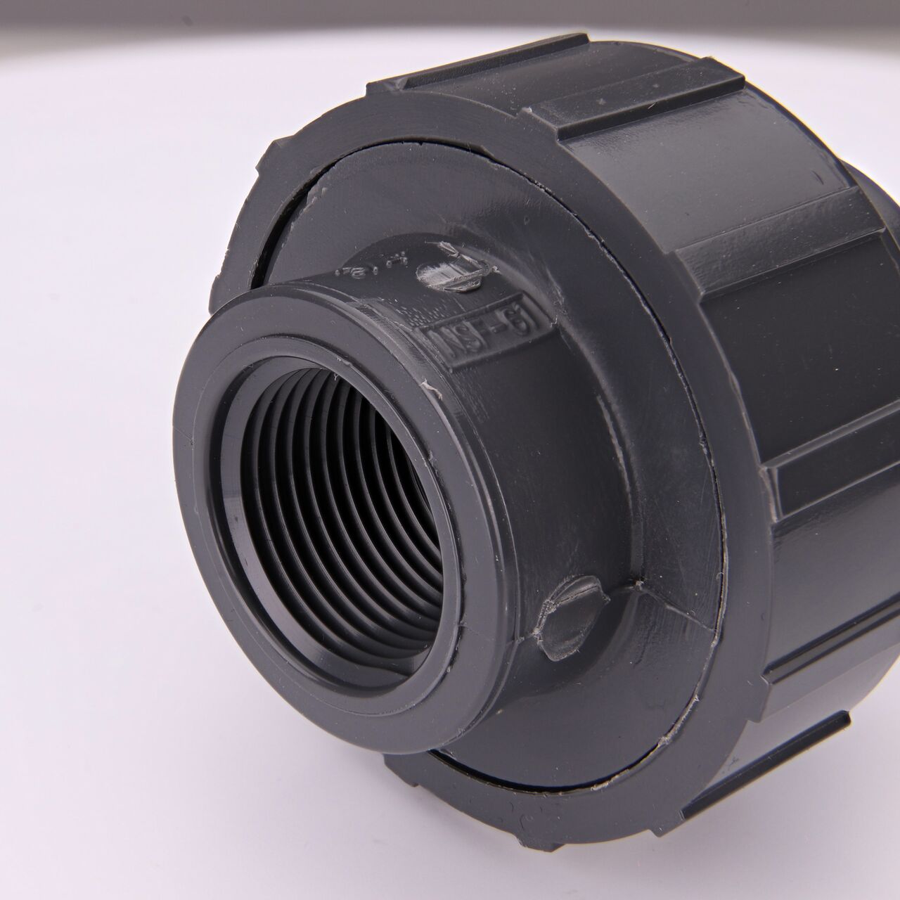 Closeup view of one threaded end on the NDS 3/4 in. PVC Union (NDS U-0750-T) which provides a corrosion-free connection between pipes and prevents costly property damage