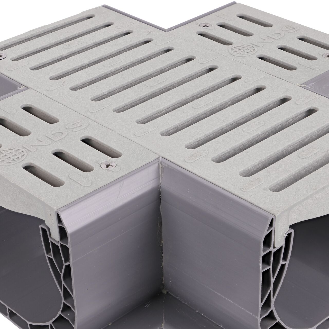 Closeup of the grate pattern of the NDS Gray Spee-D® Channel Drain Cross and Grate (NDS 2361)