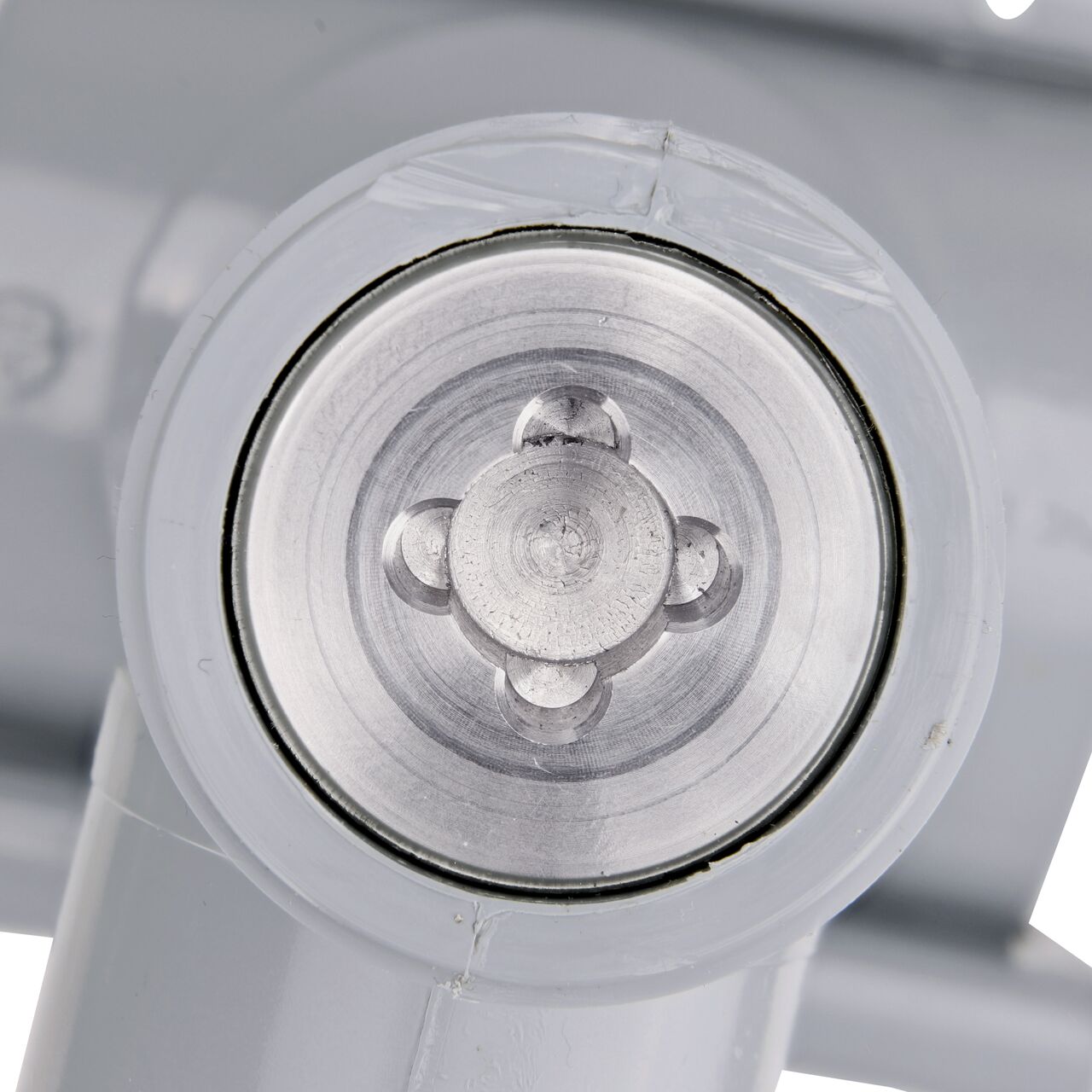 Closeup view of the built-in saw tooth cutter in the top connection of the 3 in. NDS Flo-Tap™ Rigid PVC saddle with 1-1/2 in. socket or 2 in. spigot which cuts easily through PVC pipe wall and captures debris before it can enter the water supply (NDS 3230)