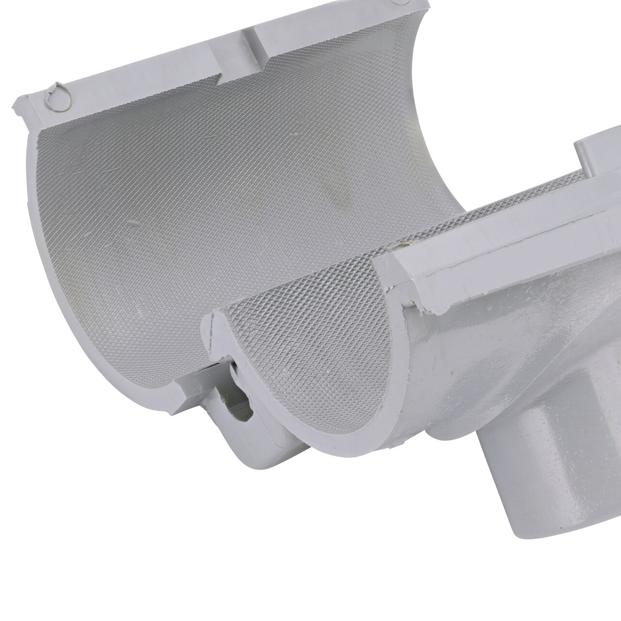 Closeup of the hinge open on the NDS Clamp-It™ Rigid PVC Saddle with 1 in. slip connection on top (NDS 432010) for 2 in. PVC pipe