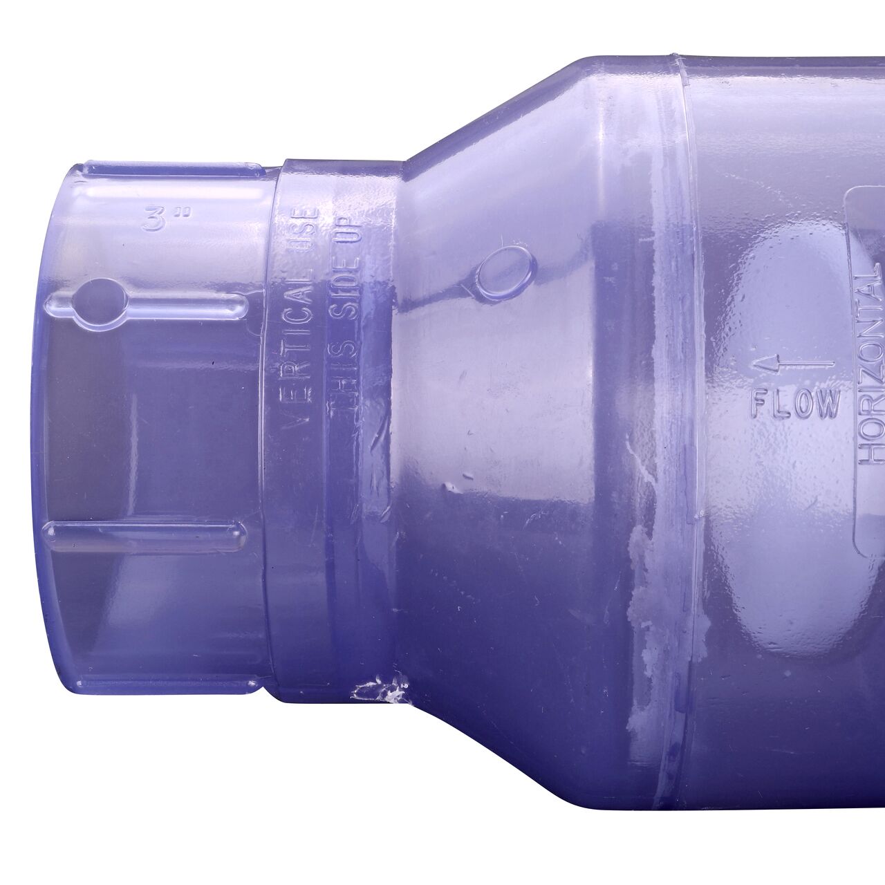 Closeup of the arrow showing water flow direction on the NDS Clear 3 in. slip end by slip end PVC Swing Check Valve (NDS 1520C30)