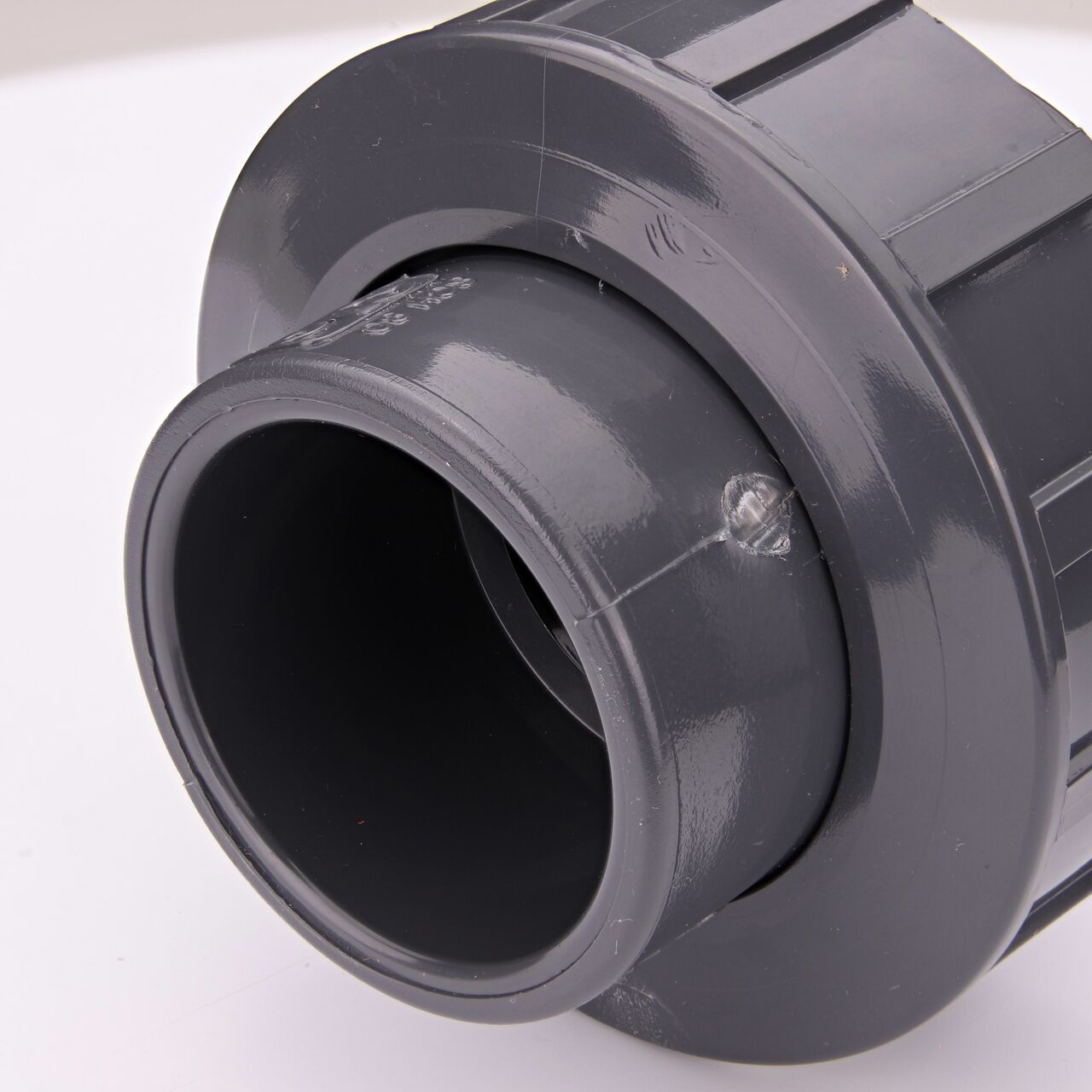 Closeup view of the other threaded end on the PVC Union, 1-1/2 in. Sch. 80 S X FPT (NDS U-1000-ST) which provides a corrosion-free connection between pipes and prevents costly property damage