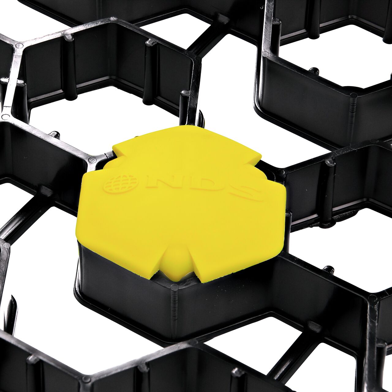 Closeup of one Yellow NDS EZ Marker™ Parking Delineators (NDS EZMARKER) installed in the NDS EZ Roll® Grass Pavers