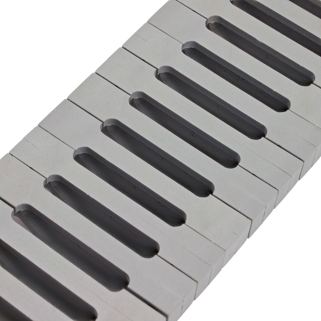 Closeup view of the Gray Nylon 5 in. Pro Series Channel Drain Grate, Load Star (NDS 828) installed on the 5 in. Pro Series Channel Drain (NDS 800)
