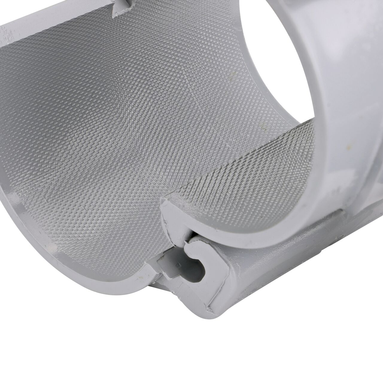 Closeup view of the hinge on the 3 in. NDS Flo-Tap™ Rigid PVC saddle with 1-1/2 in. socket or 2 in. spigot connection on top (NDS 3230) in the opened position that allows for easy installation onto Schedule 40 or Schedule 80 PVC pipe