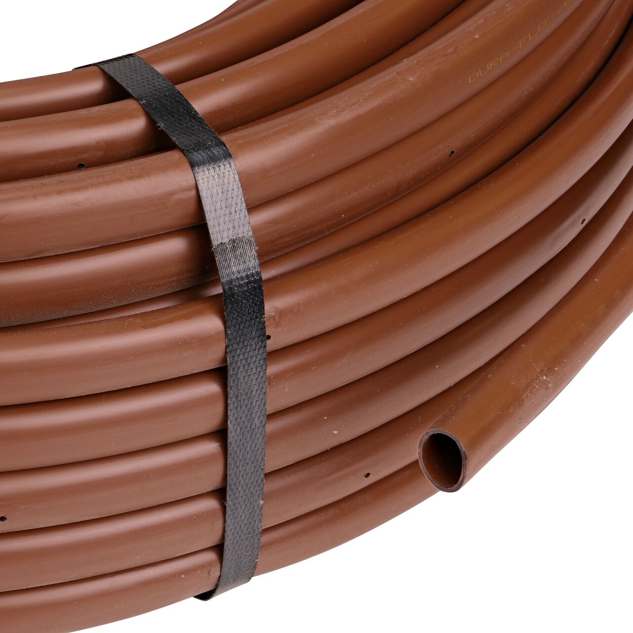 Closeup of the end of the NDS 250 ft. Brown Tubing with 0.9 GPH Pressure Compensating Emitters with 12 in. Spacing to show how to pull out the dripline (NDS SFCV-BR-7412-025, NDS SFCV-BR-7218-025)