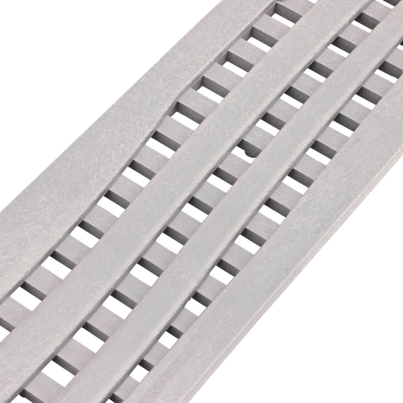 Closeup angled view of the Decorative Wave Gray Plastic Mini Channel™ Drain Grate (NDS 555GY)