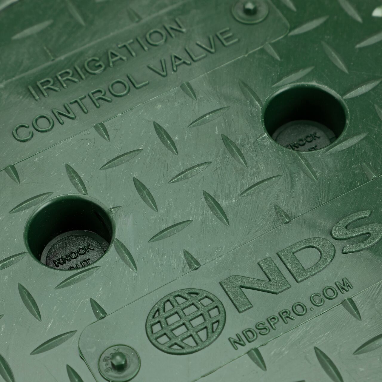 Closeup view of the locking mechanism on the Green Irrigation Control Valve cover for the NDS 6 in. Round Standard Series Valve Box (NDS 2107C)