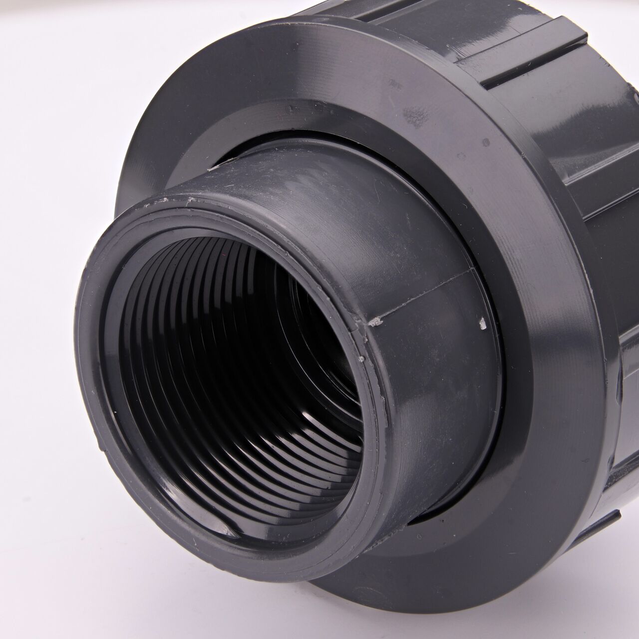 Closeup view of the other threaded end on the NDS 1-1/4 in. PVC Union (NDS U-1250-T) used to connect pipes and provide a quick way to separate pipes when needed