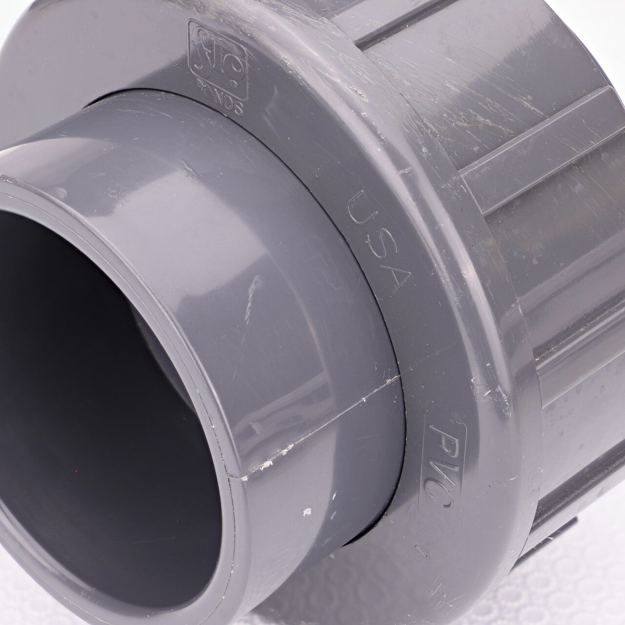 Close up view of the NDS 2-1/2 in. PVC Union showing NDS brand a leader in flow management solutions and the preferred choice of professionals since 1972 mark (NDS U-2500-S)