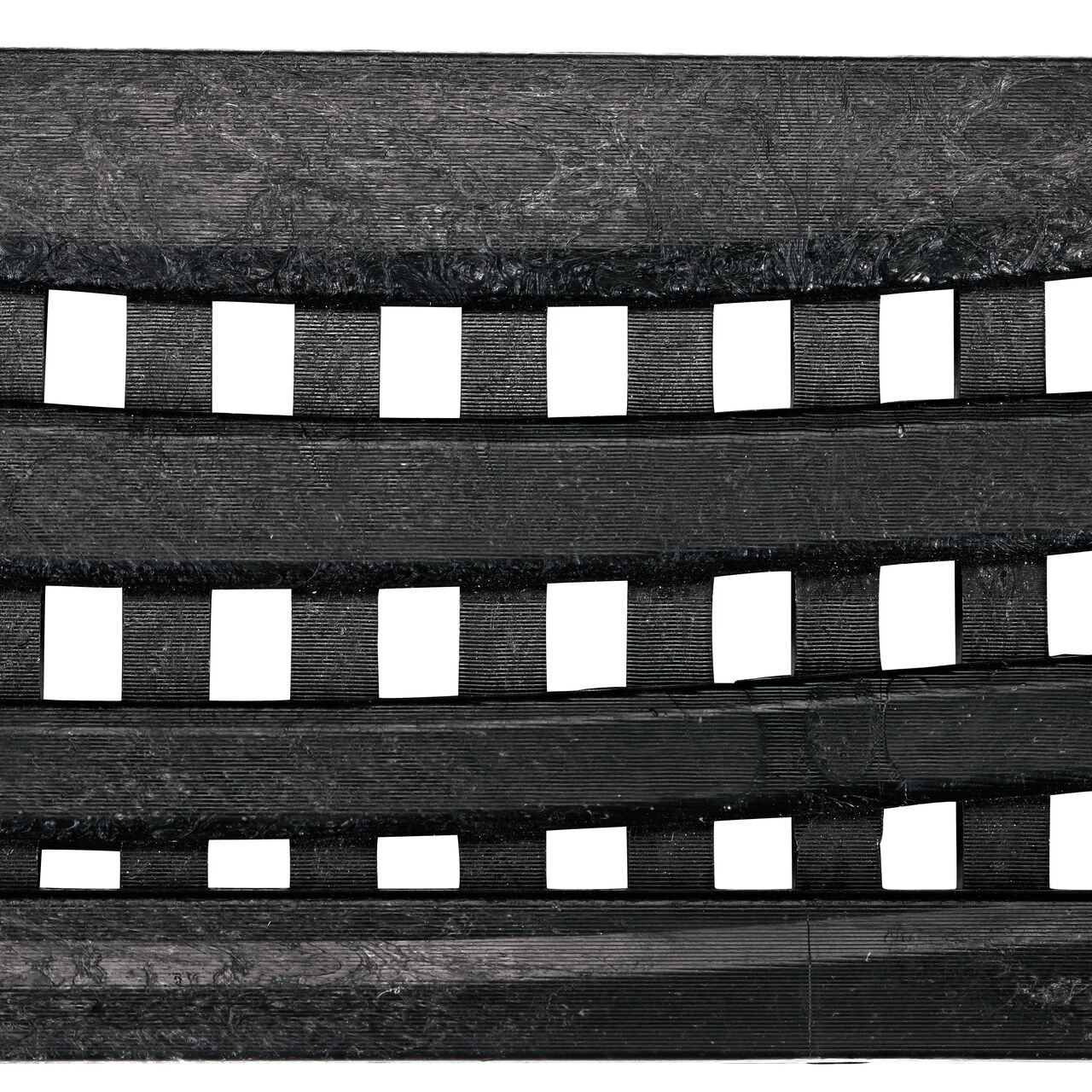 Top down view of the Decorative Wave Black Plastic Mini Channel™ Drain Grate (NDS 555)