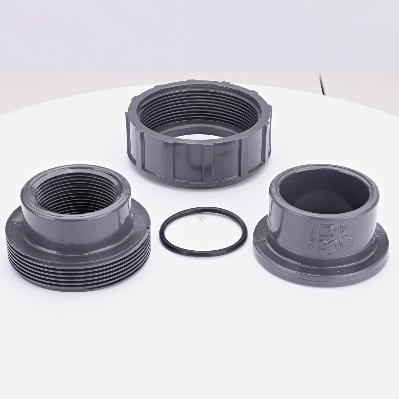 NDS PVC Union, 1-1/2 in. Sch. 80 S X FPT shown here unassembled includes the EPDM O-ring that is placed in the center of the union to create a leak-resistant seal (NDS U-1000-ST)