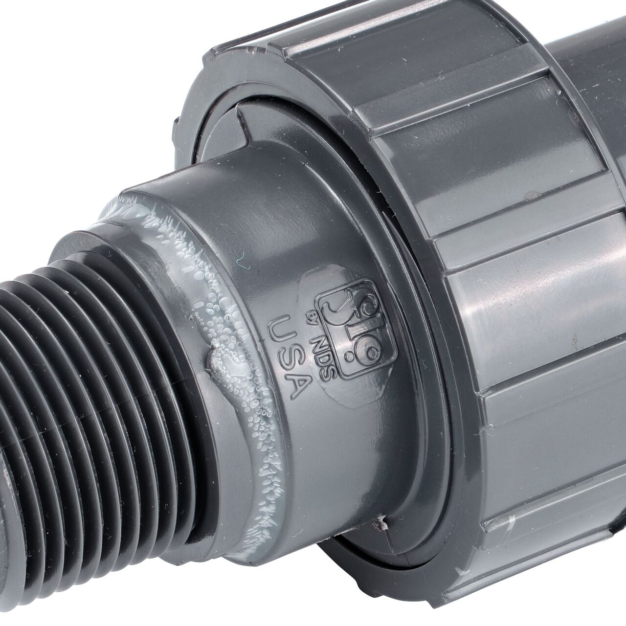 Close up view of the NDS 1 in. PVC Union showing NDS brand a leader in flow management solutions and the preferred choice of professionals since 1972 mark (NDS U-1000-SM)