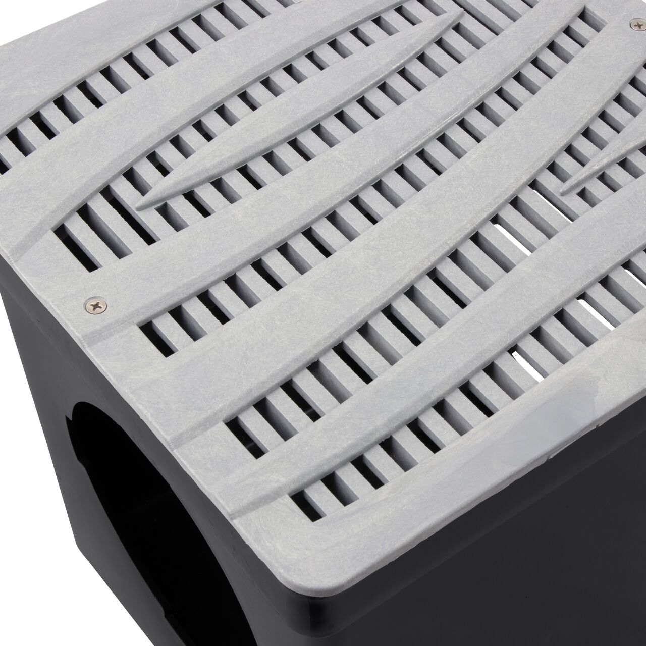 Closeup shot of NDS 12 in. Square Catch Basin Drain Grate, Decorative Wave Design, Gray Plastic (NDS 1224GY) and how it fits securely within a 12 in. Square Catch Basin Drain with 2 Openings (NDS 1200*); retail