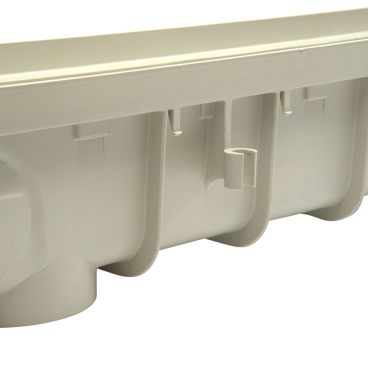 Side view of NDS 5 in. Pro Series Channel Drain featuring side ribs, stabilizing ribs, and built-in saw guide (NDS 864G*, NDS 864, NDS 864GMTL, NDS M864G, NDS 800)