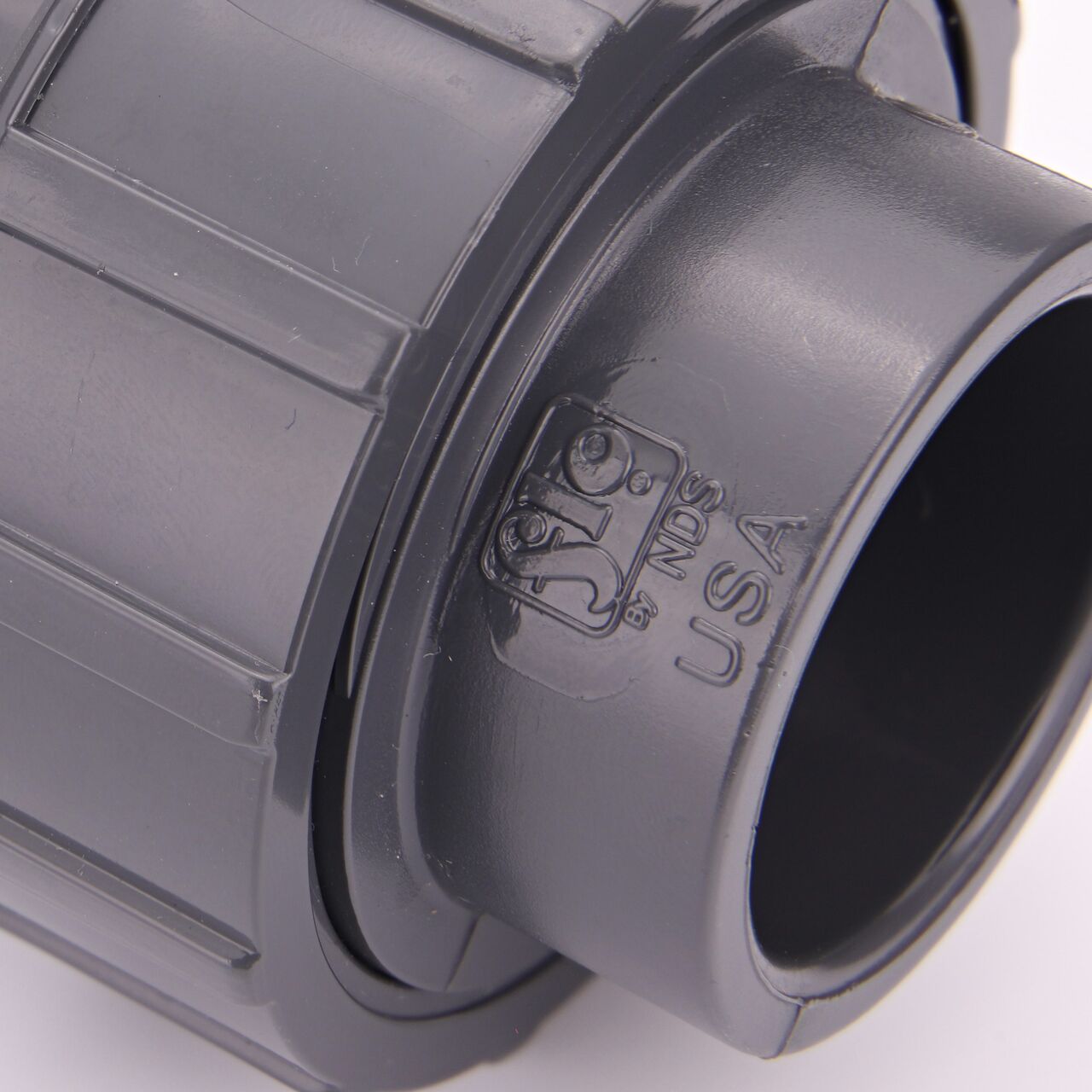Close up view of the NDS 1 in. PVC Union showing NDS brand a leader in flow management solutions and the preferred choice of professionals since 1972 mark (NDS U-1000-S)