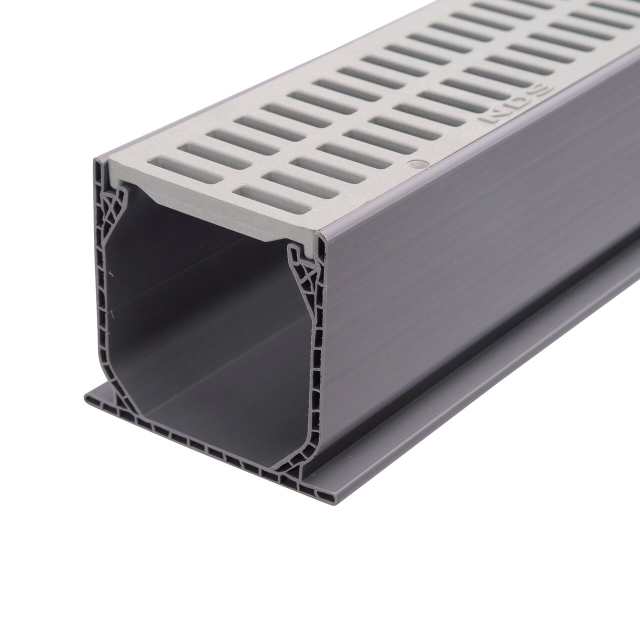 Gray Plastic Mini Channel™ Drain Grate (NDS 541-1*, NDS 541) sits securely in the Mini Channel™ Drain (NDS 500) which has a patented flying buttress design for load-bearing support