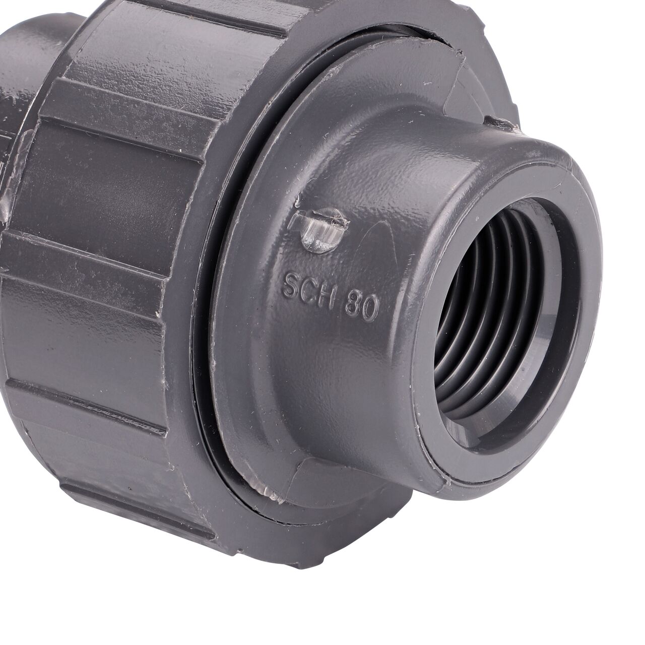 Closeup view of the NDS 1/2 in. PVC FPT Union shows each end is labeled that it connects to 1/2 in. Schedule 80 pipe for residential, commercial, and industrial applications (NDS U-5000-T)