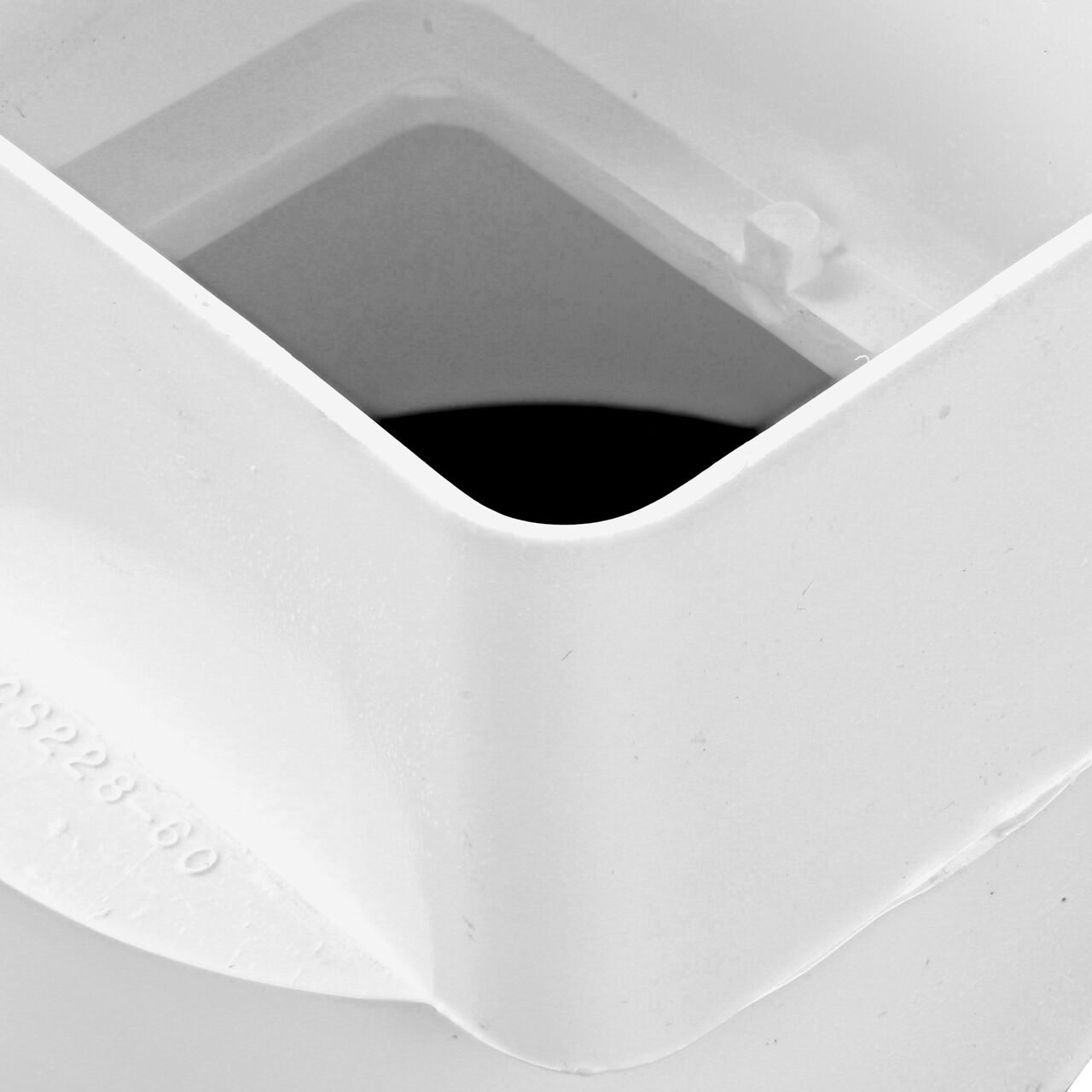 Closeup of the 4 in. DWV/SCH40 Hub of the PVC offset downspout adapter (NDS 9P09)