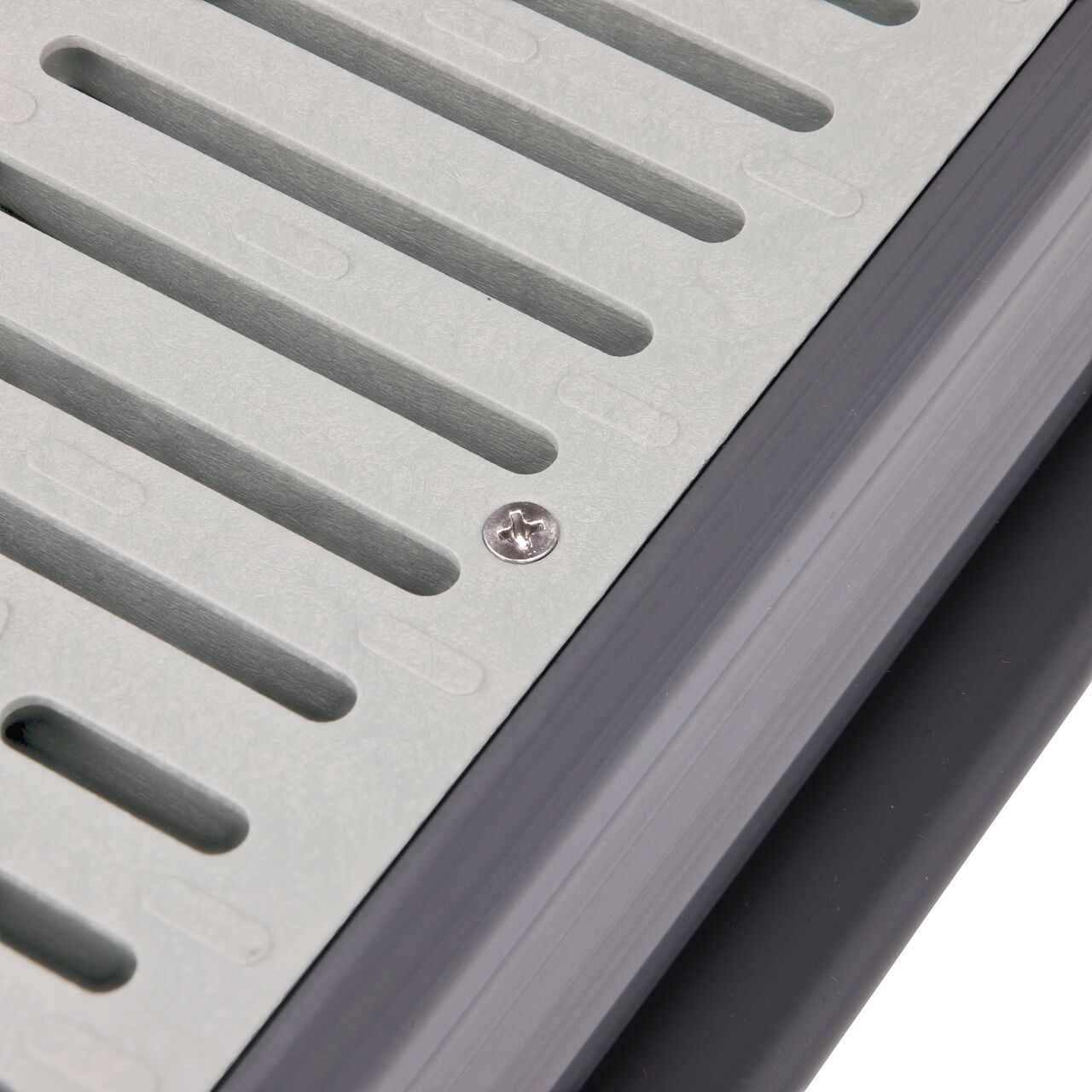 Closeup of #8 X 1 in. Phillips Flat Head Screw securing standard grate to Spee-D Channel (NDS 229)