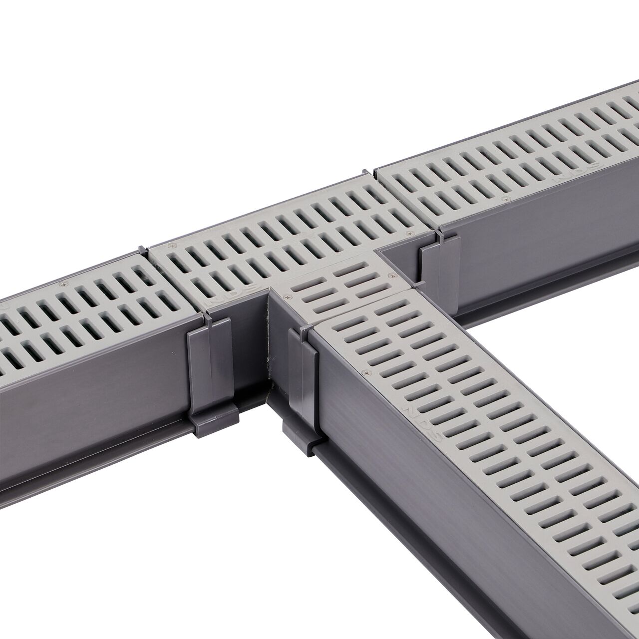 Fully installed NDS Gray Mini Channel™ Drain Tee and Grate (NDS 5370) with couplers and channel drains with grates