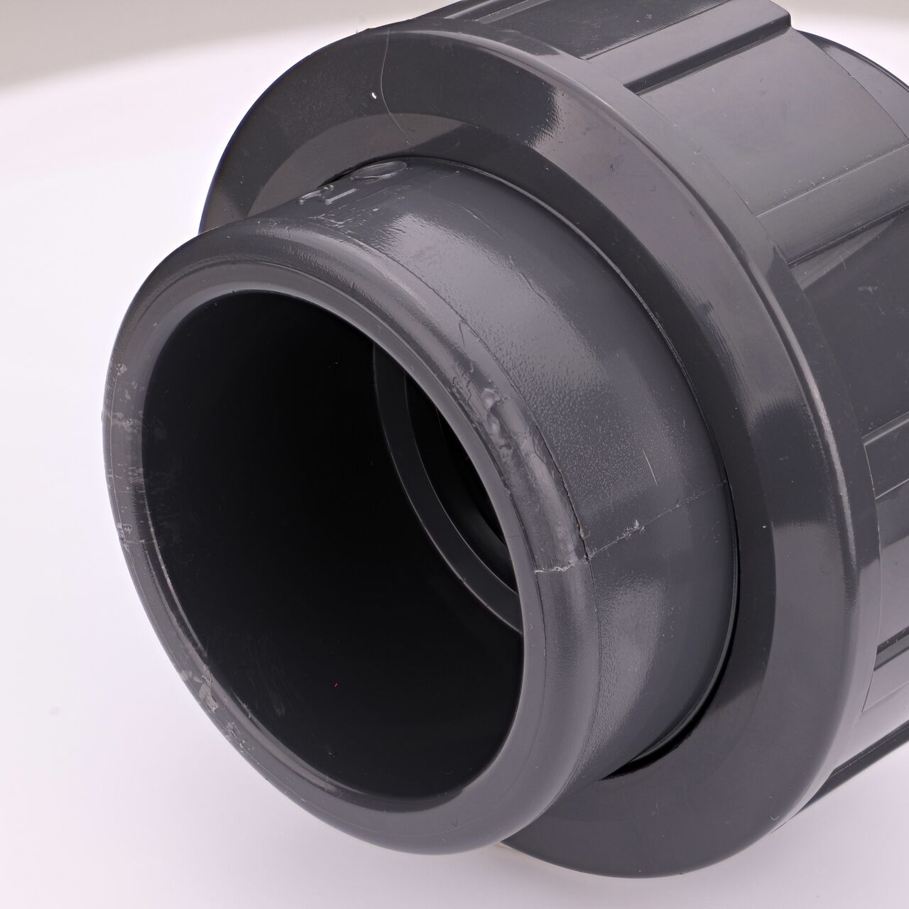 Closeup view of the other threaded end on the PVC Union, 2 in. Sch. 80 S X FPT (NDS U-2000-ST) which provides a corrosion-free connection between pipes and prevents costly property damage