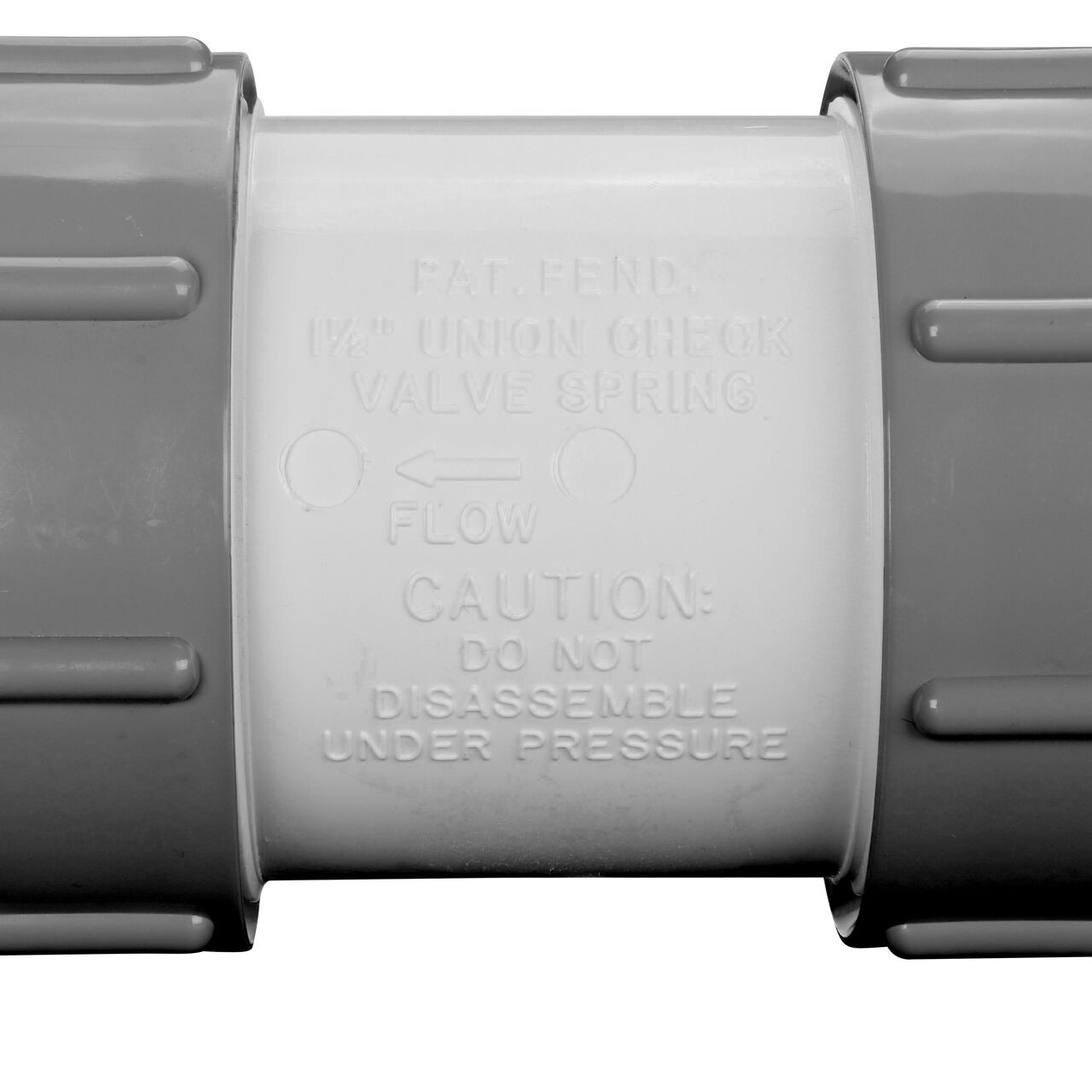 Closeup of the directional arrow on the NDS 1-1/2 in. IPS slip by slip PVC Compact True Union Spring Check Valve (NDS 1790-15)
