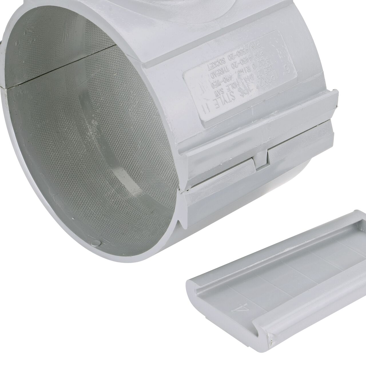 Closeup of the wedge latch uninstalled on the NDS Clamp-It™ Rigid PVC Saddle with 1-1/2 in. slip connection on top (NDS  456015) for 6 in. PVC pipe