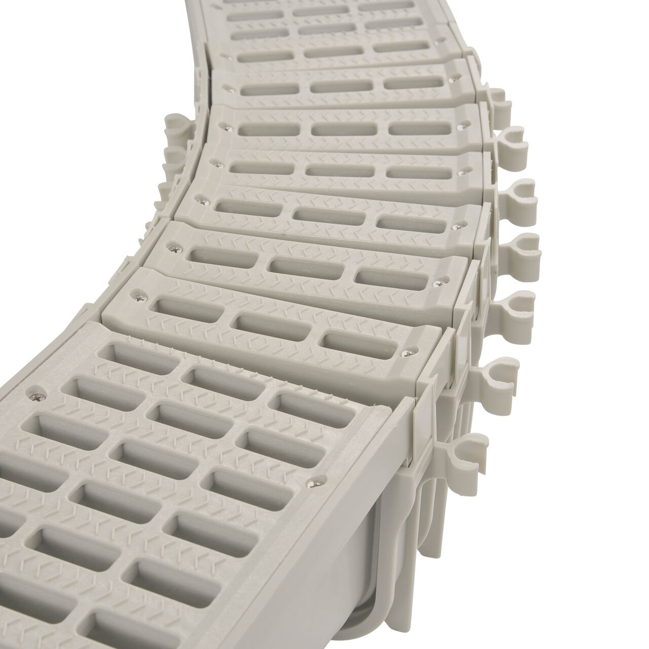 Several NDS 5 in. Pro Series Channel™ Drain Qwik-Turn™ Deep Profile Radius Couplings connected together (NDS PSRC-864) with 5 in. Pro Series Channel Drain (NDS 800) on each end
