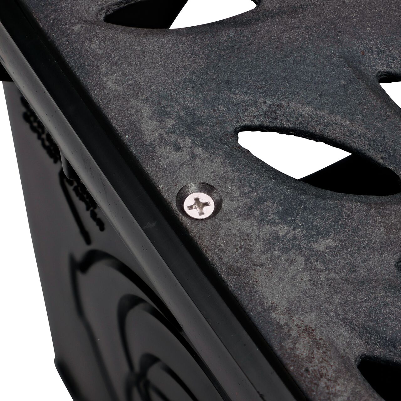 Closeup of #6 X 1-1/4 in. Phillips Flat Head Screw securing cast iron botanical grate to 12 in. Catch Basin (NDS 829)