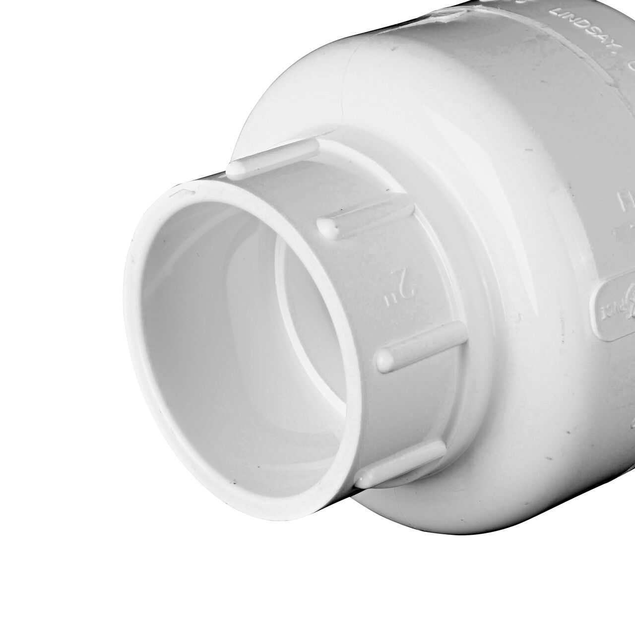 Closeup of the inlet end of the NDS White 2 in. female end by female end PVC Swing Check Valve (NDS 1520-20F) which prevents backflow in pipelines