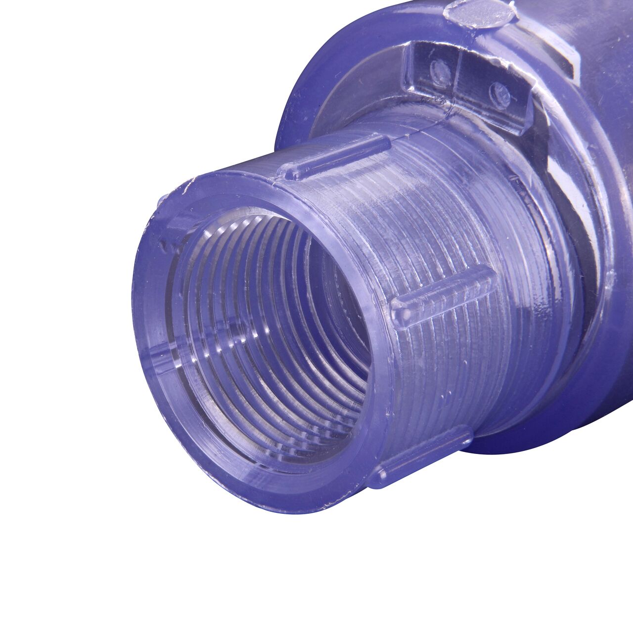 Closeup of the outlet end of the NDS Clear 1 in. female end by female end PVC Swing Check Valve (NDS 1520C10F) which prevents backflow in pipelines