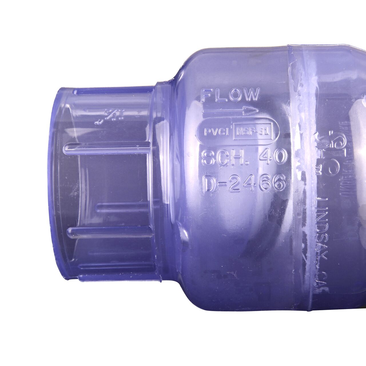Closeup of the arrow showing water flow direction on the NDS Clear 1-1/2 in. slip end by slip end PVC Swing Check Valve (NDS 1520C15)